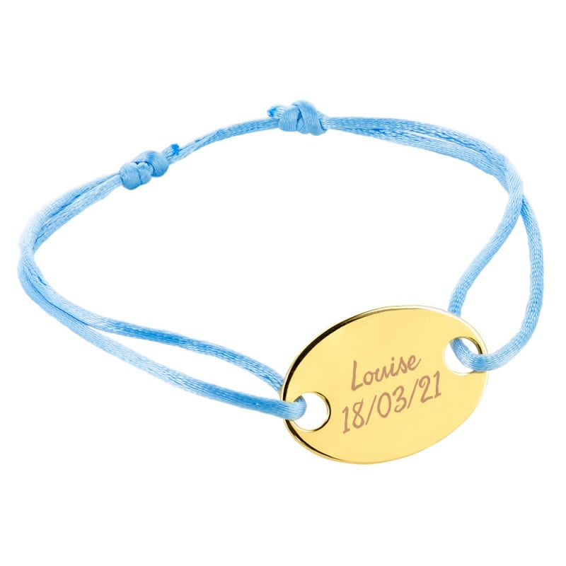 Bracelet ovale plaqué or gravé avec cordon bleu
