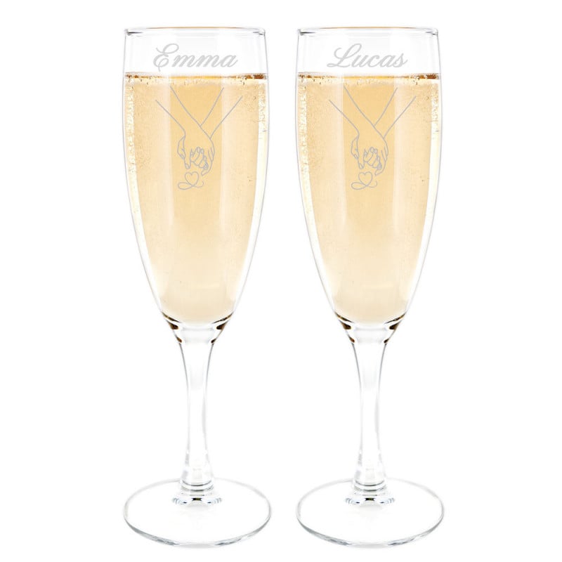 Duo de flûtes à champagne mains entrelacées