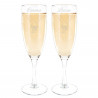 Duo de flûtes à champagne mains entrelacées